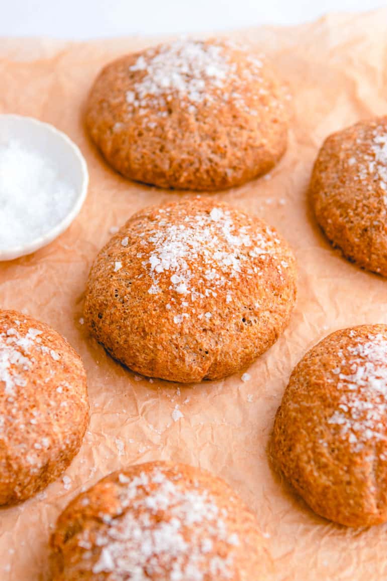 easy healthy whole wheat vegan dinner rolls on parchment paper