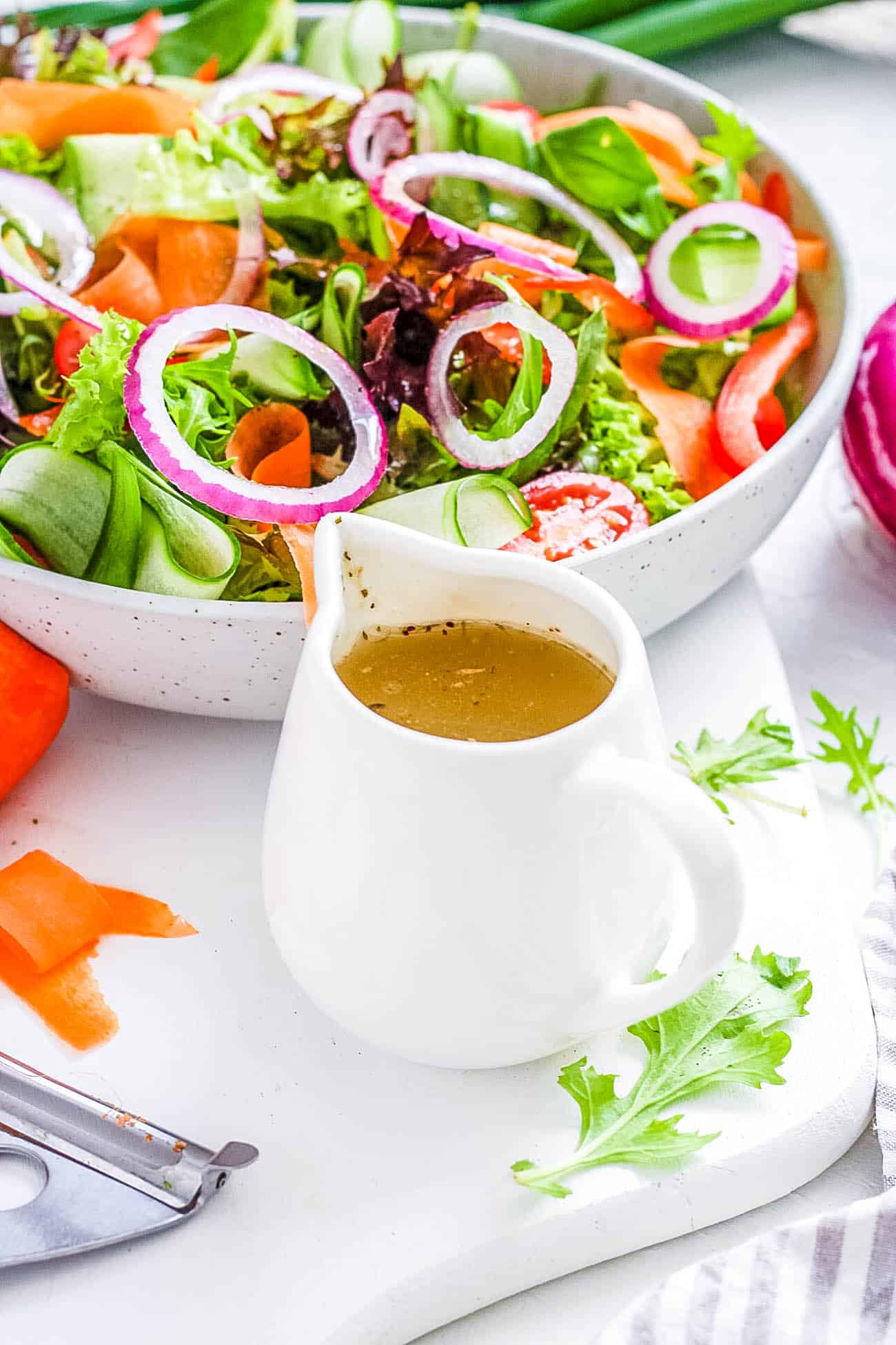 easy creamy homemade healthy vegan italian dressing recipe in a white pitcher