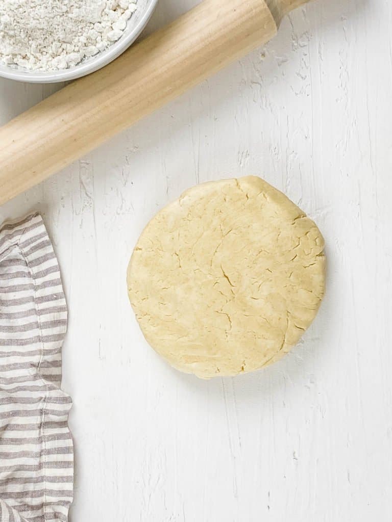 gluten free pie dough resting on a cutting board