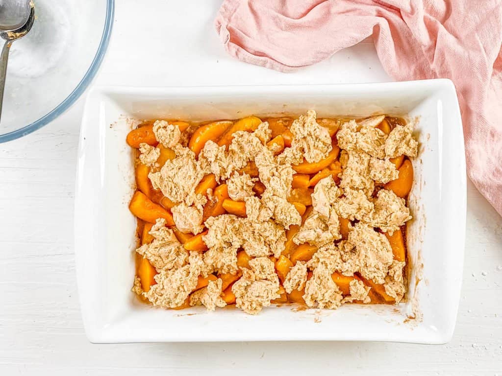 vegan biscuit topping added to casserole dish
