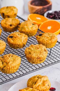easy healthy vegan gluten free orange cranberry muffins recipe on a wire rack
