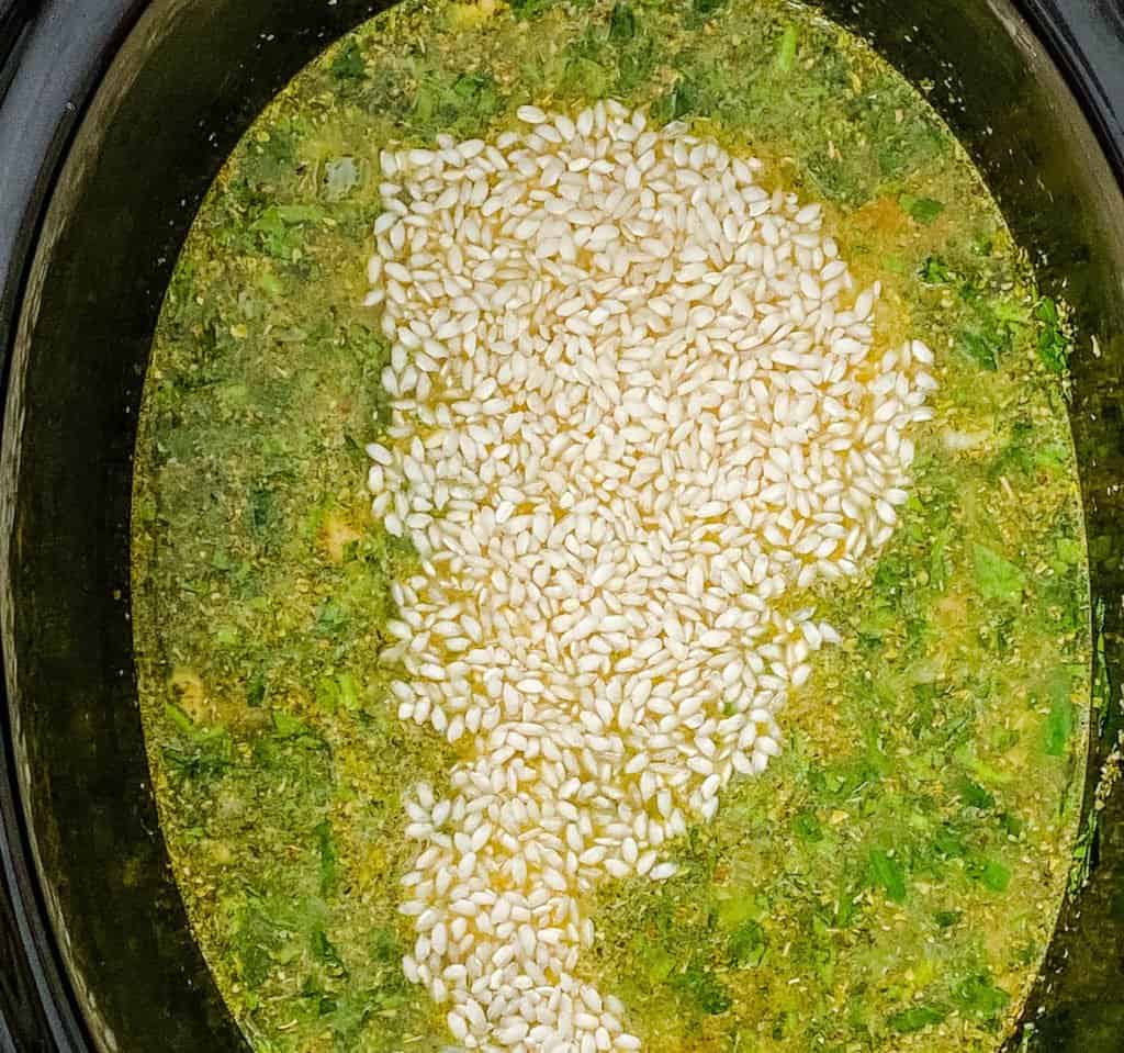arborio rice added to pot with veggies