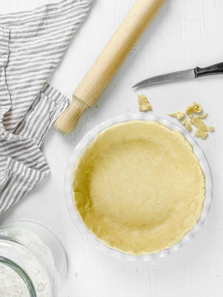 unbaked 3 ingredient gluten free pie crust recipe - healthy, homemade and with a vegan option in a pie plate