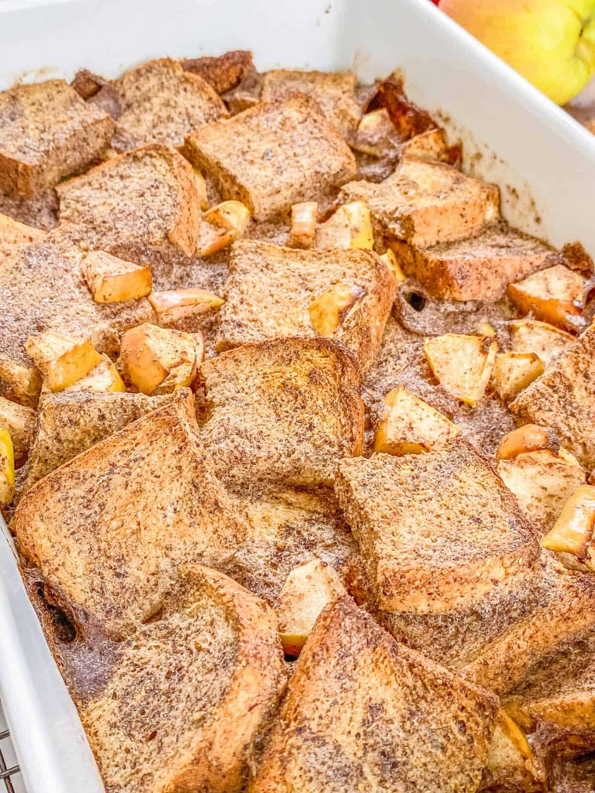 Close up angld shot of a pan of vegan french toast casserole after coming out of the oven.