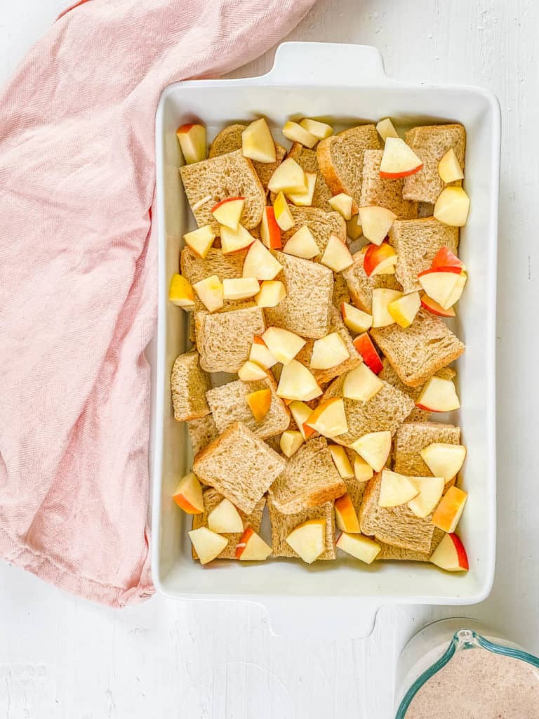 apples and bread in a casserole dish.