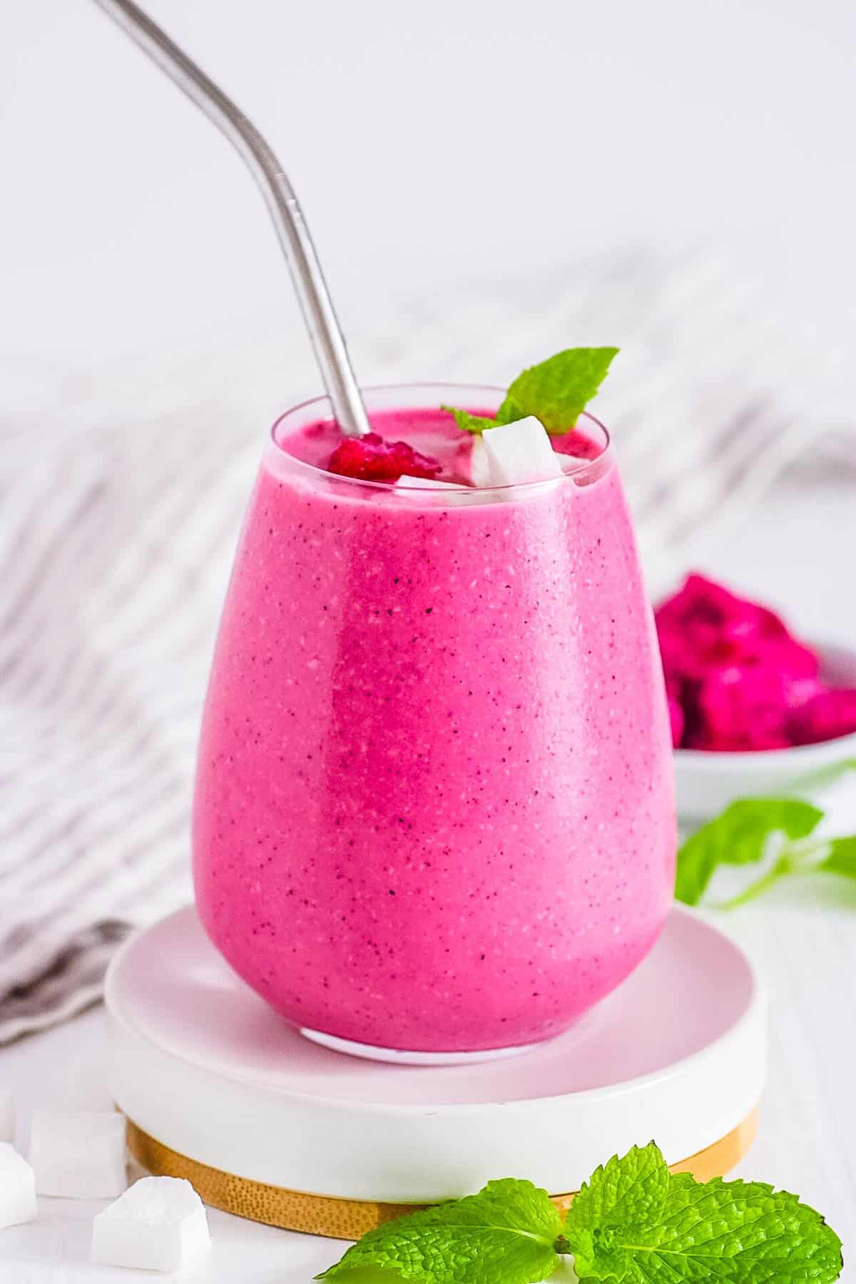 easy healthy dragon fruit smoothie recipe with banana and mango in a glass