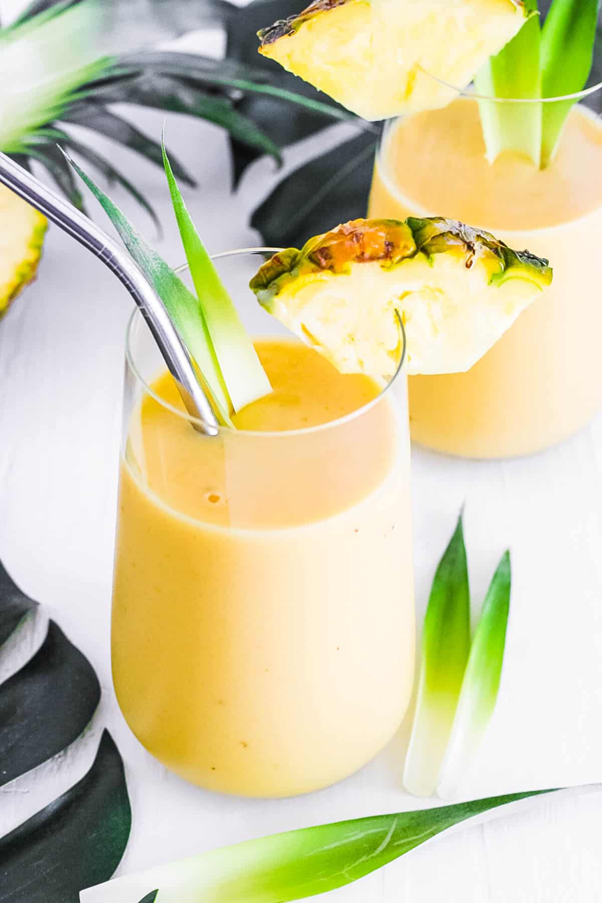 easy healthy vegan mango pineapple banana smoothie recipe in a glass