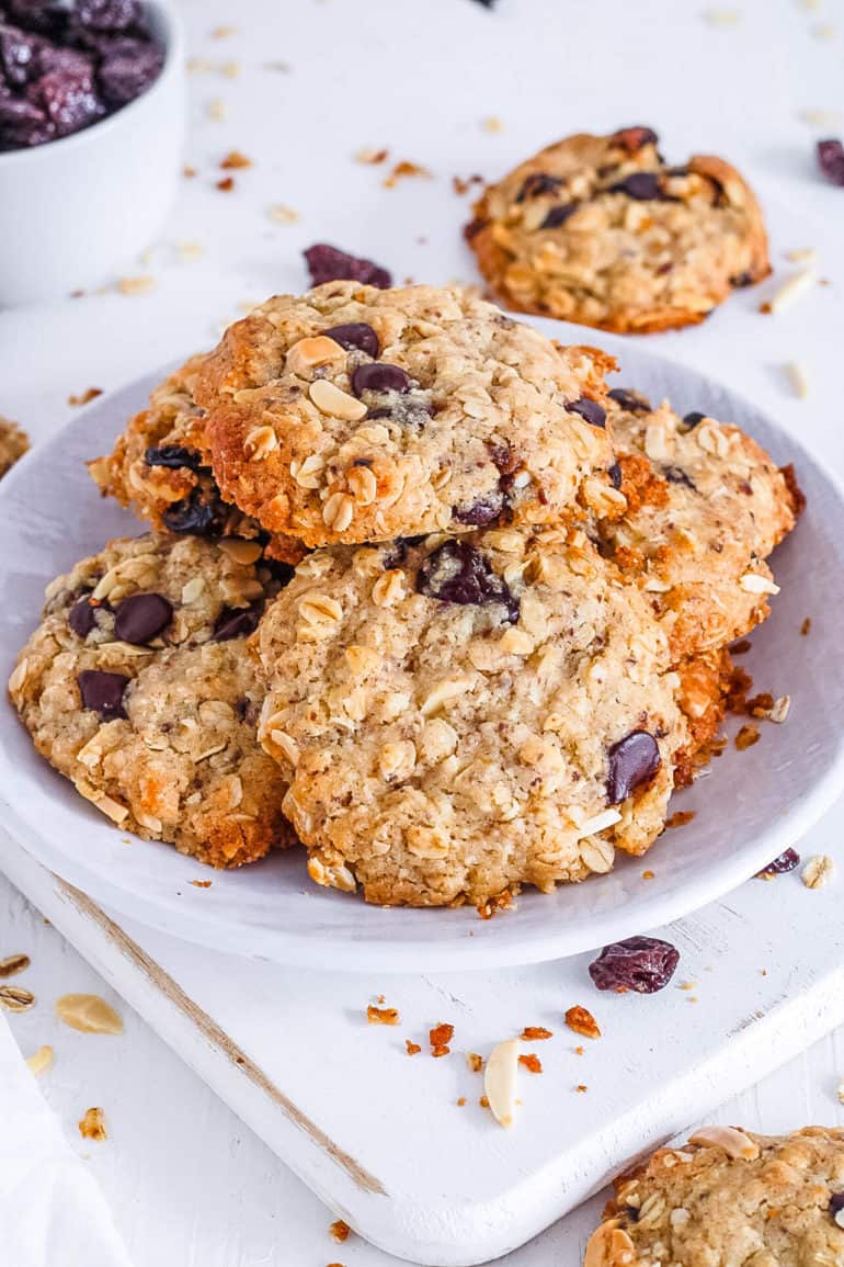 easy healthy vegan oatmeal chocolate chip cookies recipe stacked on a white plate
