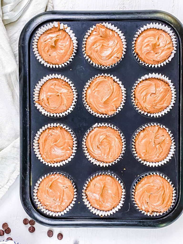 chocolate filling added to muffin tins