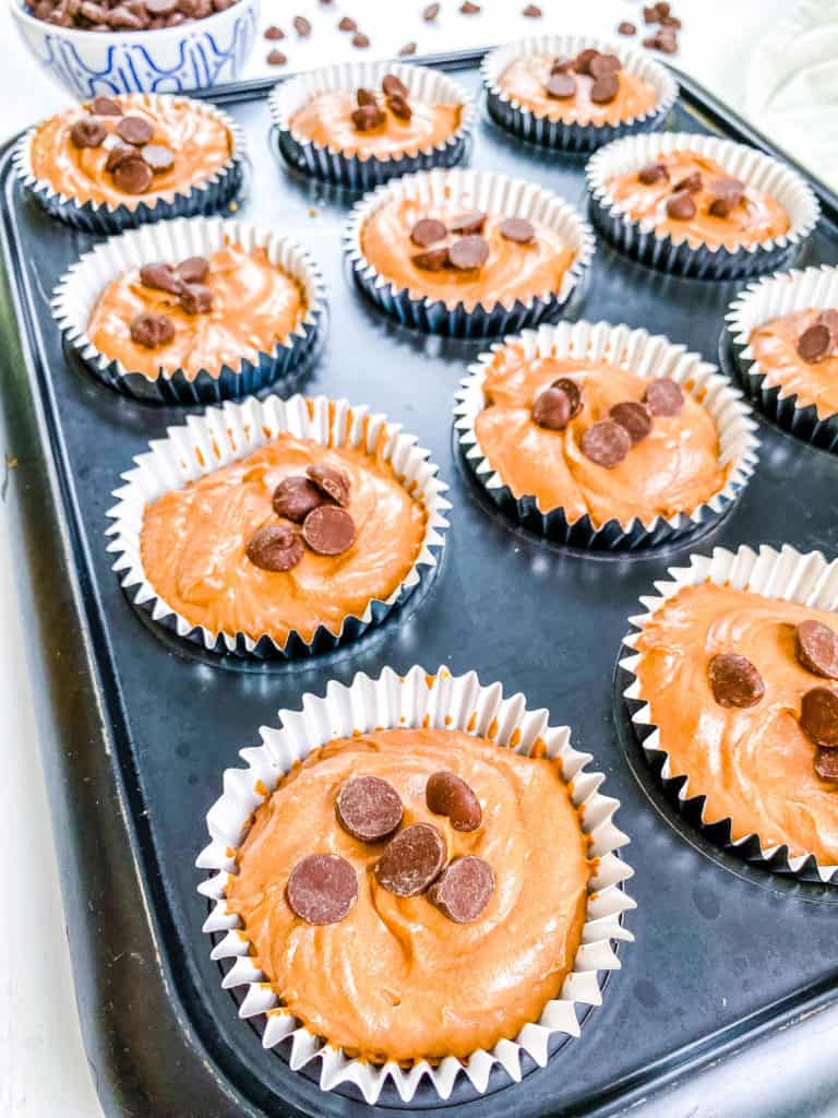 chilled easy no bake mini chocolate cheesecakes in a muffin tin