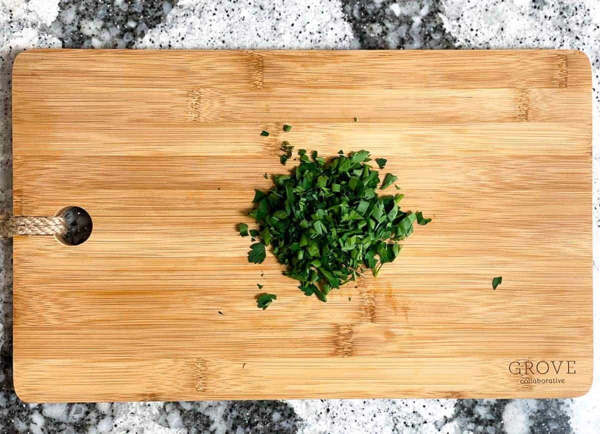Chopped parsley on cutting board.