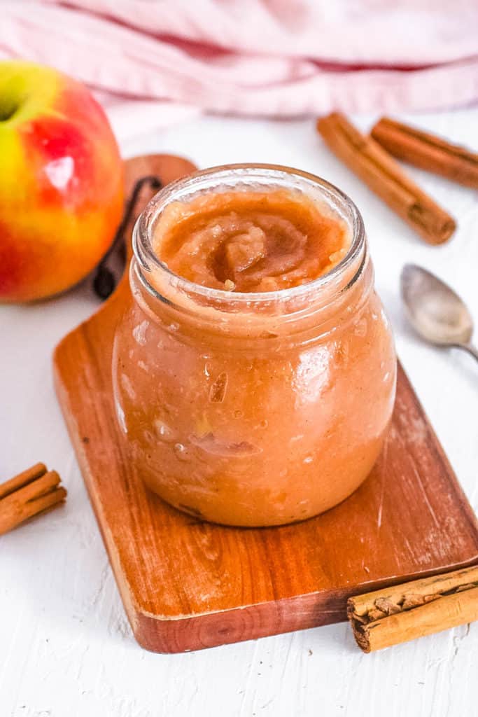 healthy vegan low sugar instant pot apple sauce recipe in a glass jar