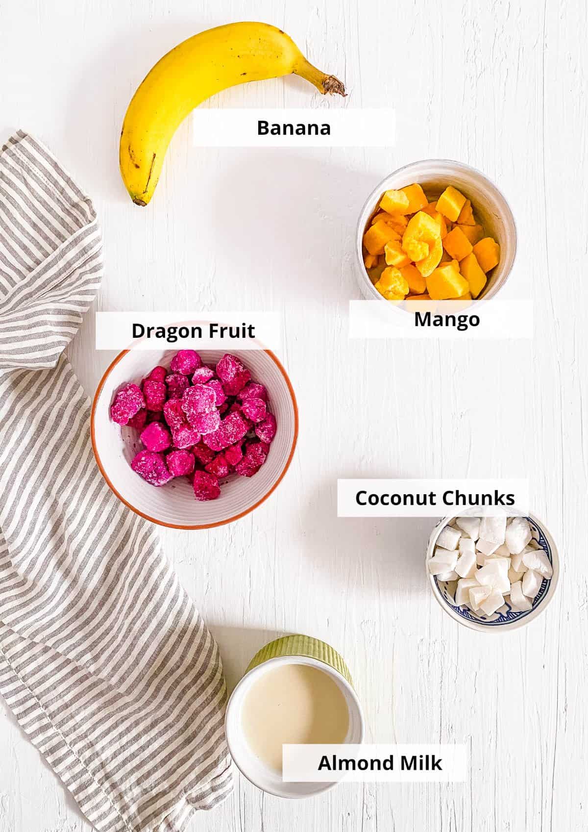 All of the ingredients for easy healthy dragon fruit smoothie recipe with banana and mango.