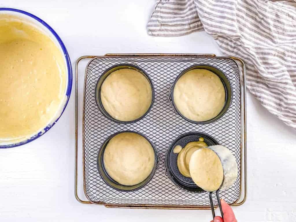 pancake batter poured into springform tins