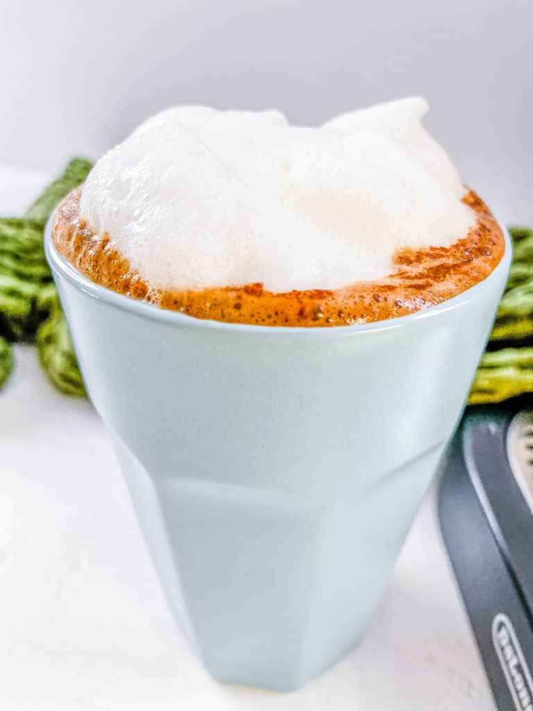 frothed milk in a glass