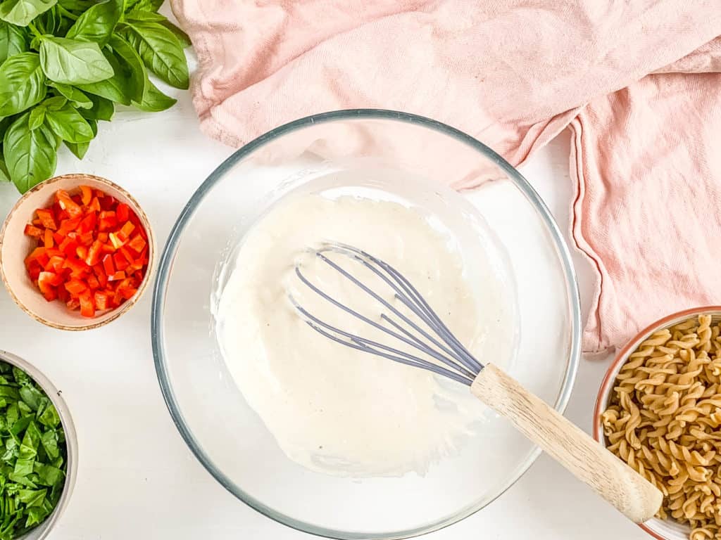 dressing whisked in a mixing bowl