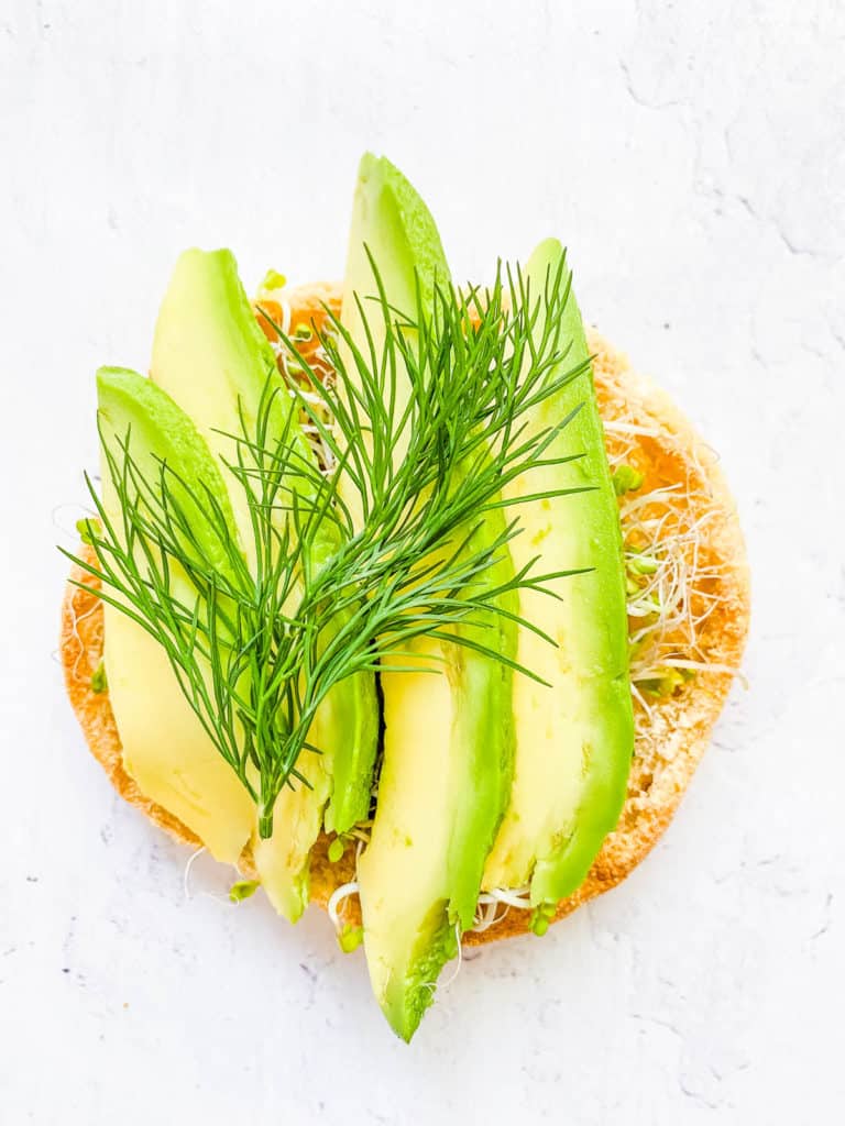 avocado and alfalfa sprouts on toast