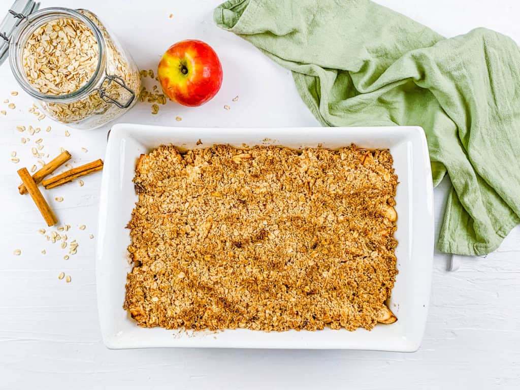 baked apple pie crisp in a casserole dish