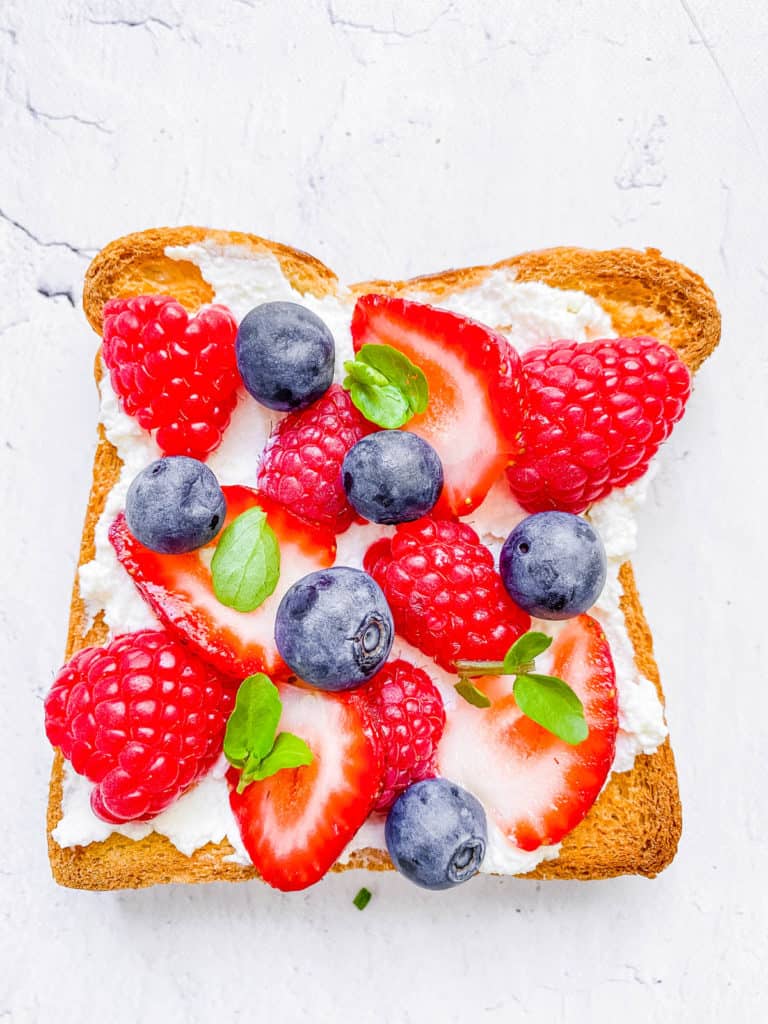 goat cheese and berries on toast