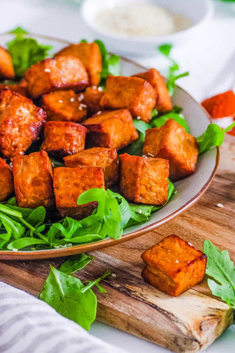 healthy easy vegan air fryer tempeh recipe on a white plate with greens