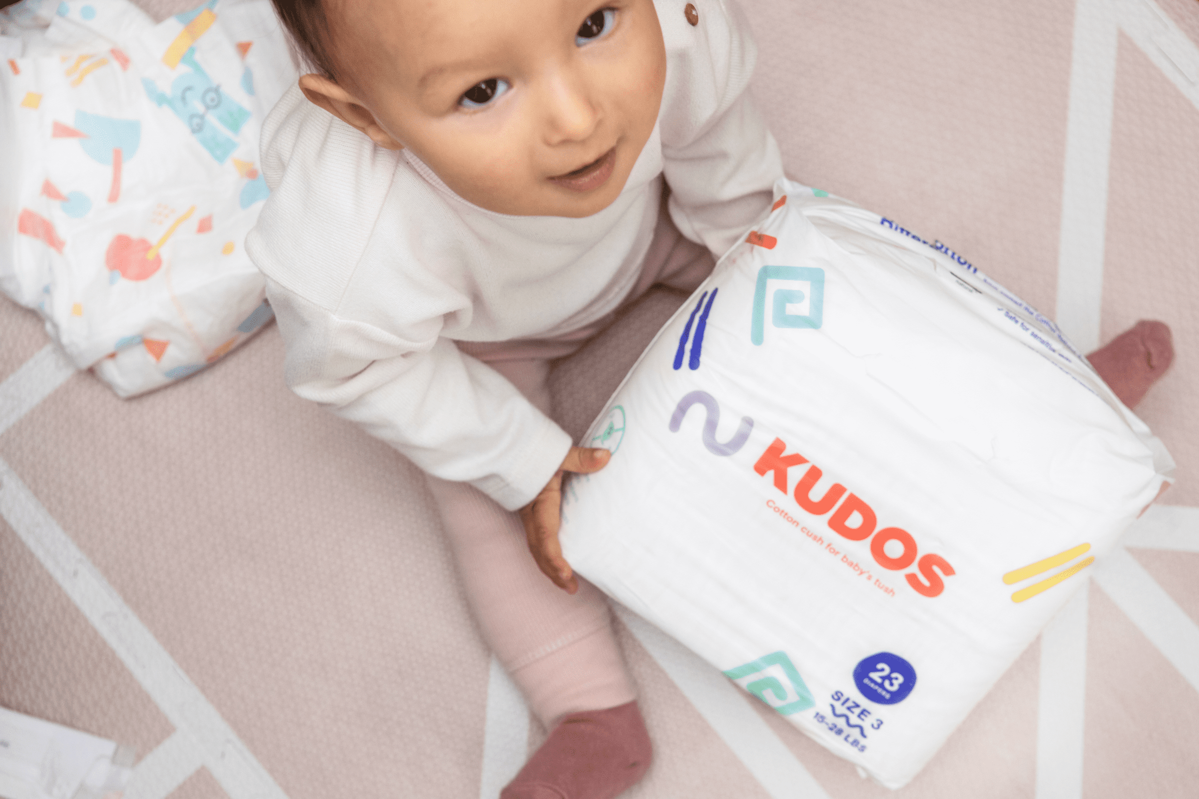 baby with kudos diaper package