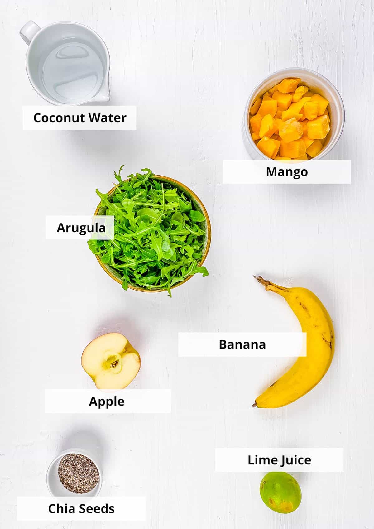 ingredients for easy, healthy, vegan arugula smoothie with banana, apples and mango
