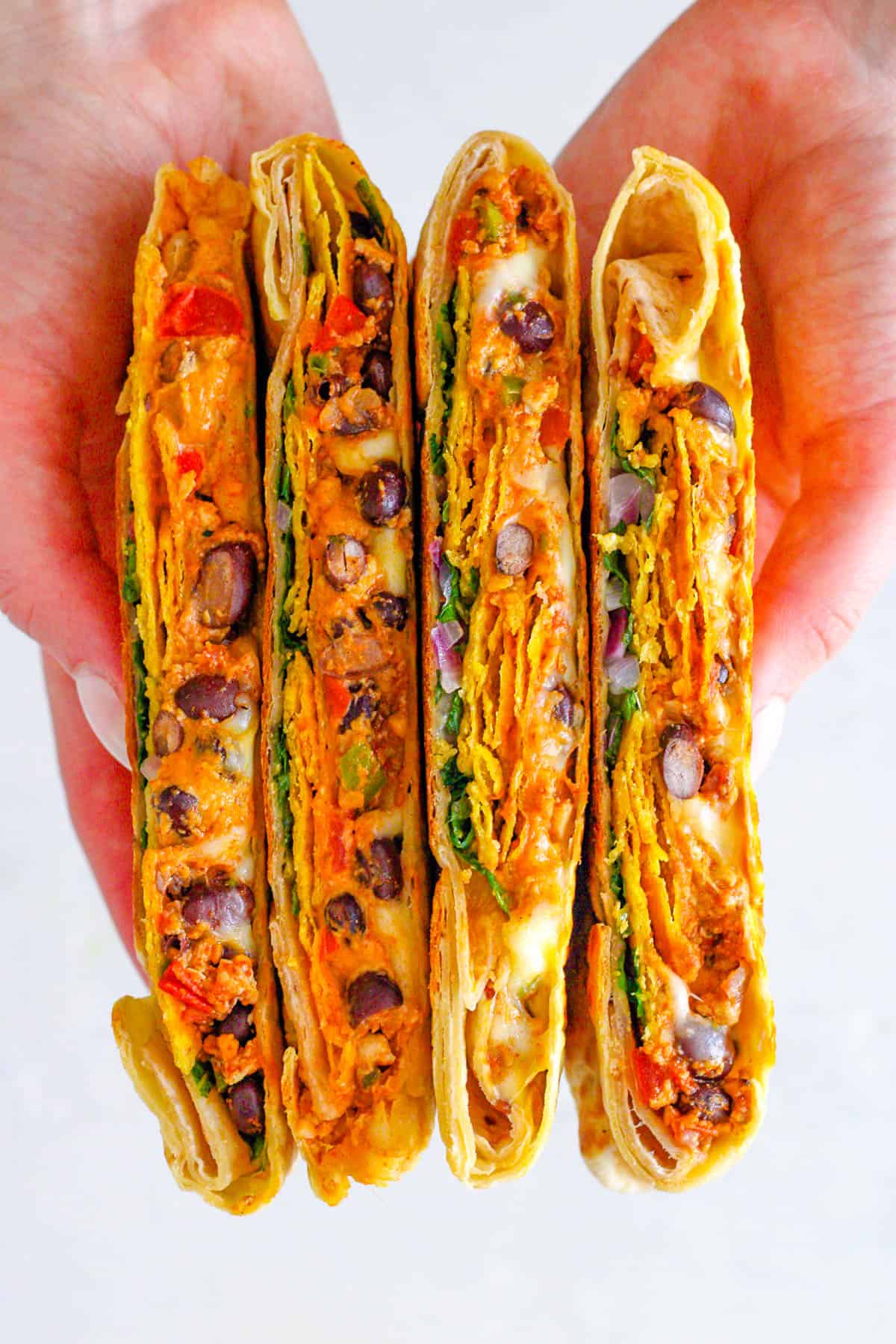 closeup of inside of healthy vegan crunchwrap supreme - taco bell copycat recipe