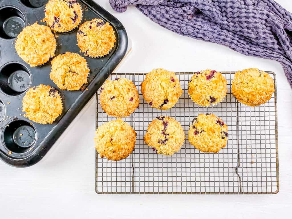 baked blueberry sourdough muffins on wire rack