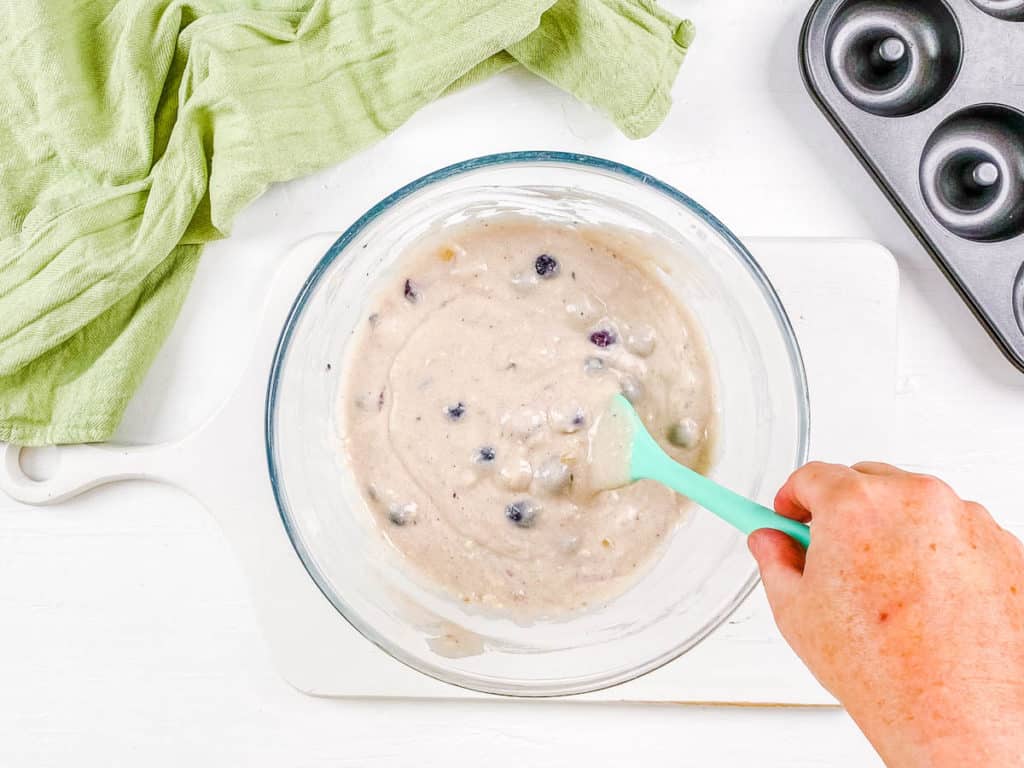 batter for blueberry doughnuts in a mixing bowl