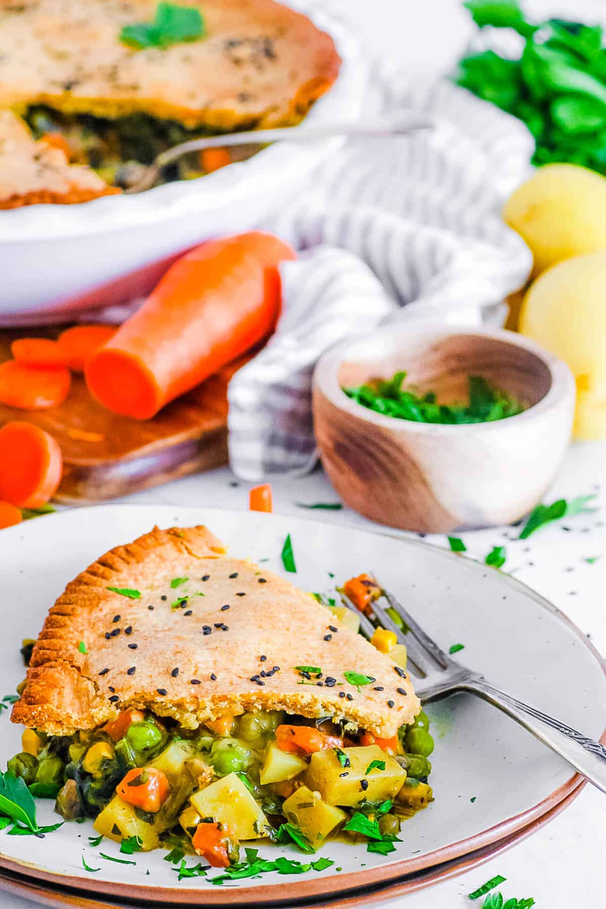 slice of vegan pot pie on a white plate