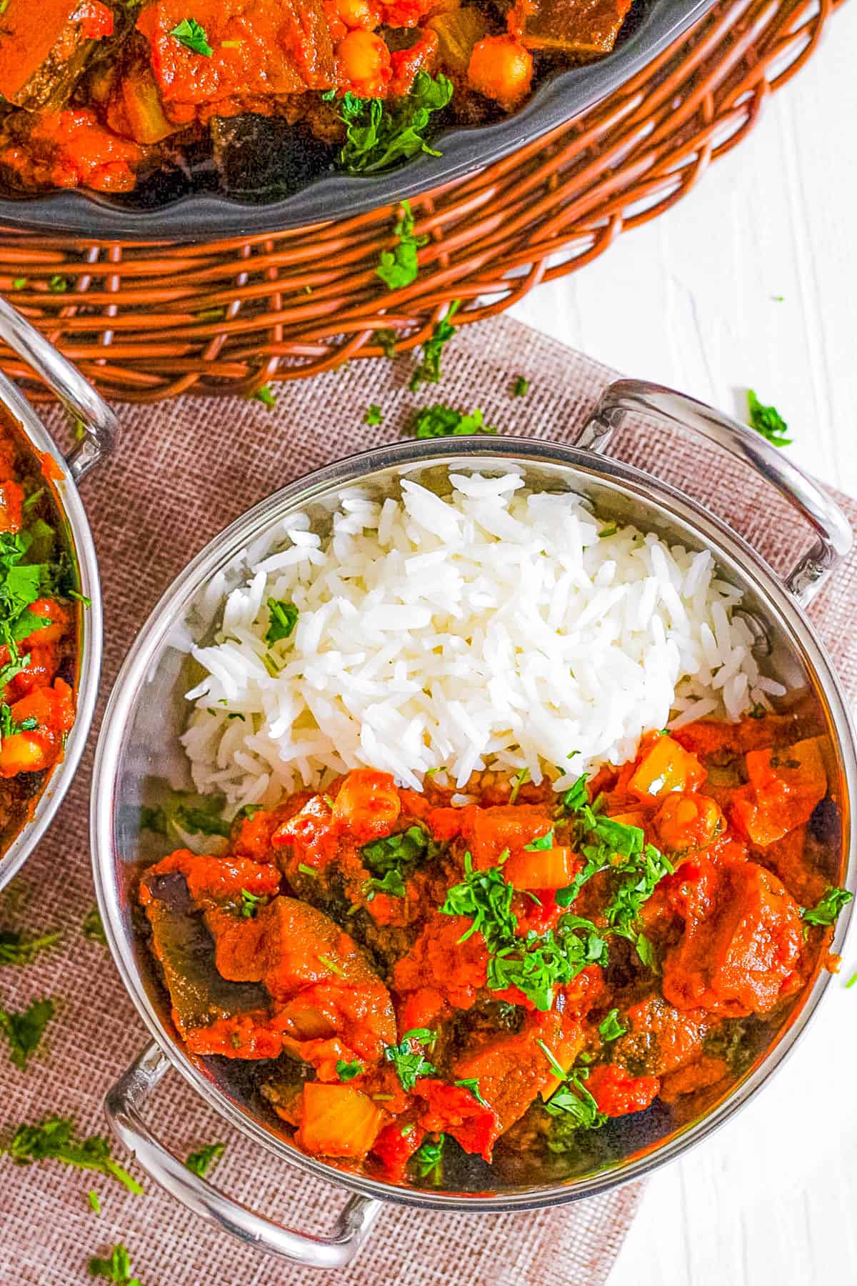 aubergine curry (or brinjal curry / eggplant curry) served with rice in a bowl