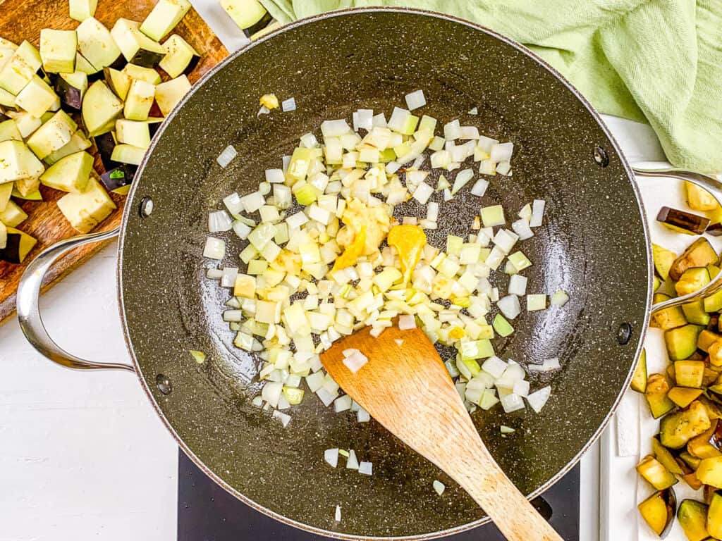 onions and aromatics sauteeing in a pot