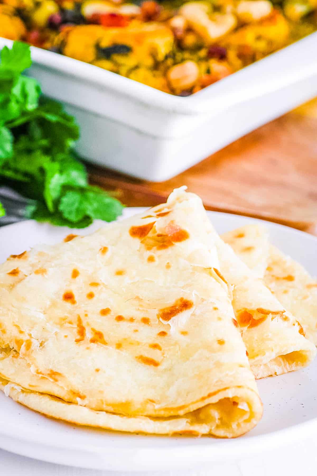 easy guyanese roti recipe on a white plate