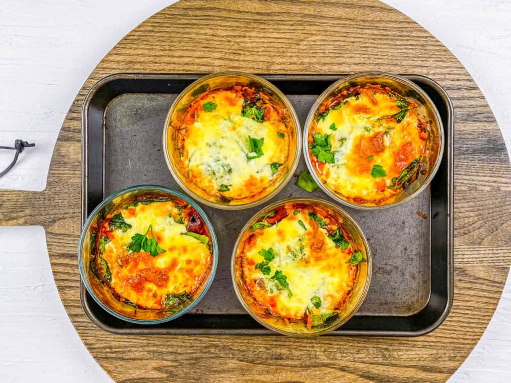 baked pizza bowls on a baking sheet