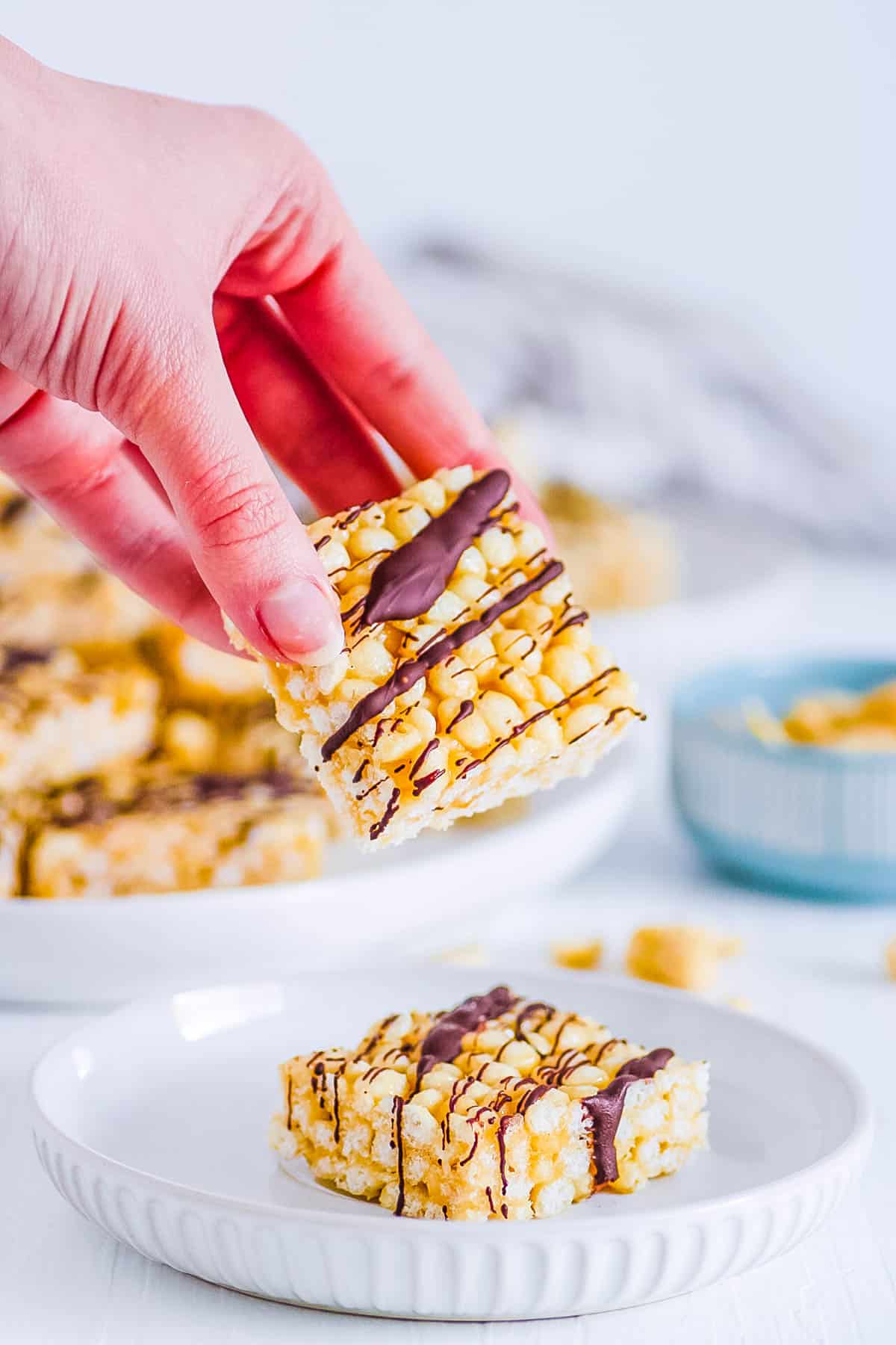 low calorie, healthy rice krispie treats being picked up to eat