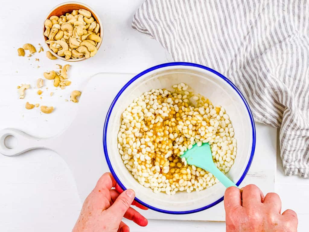 brown rice crisps and sugar mixed in a bowl