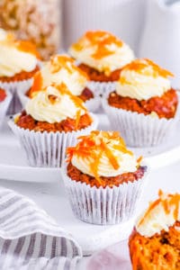 easy vegan carrot cake cupcakes recipe on a cupcake stand