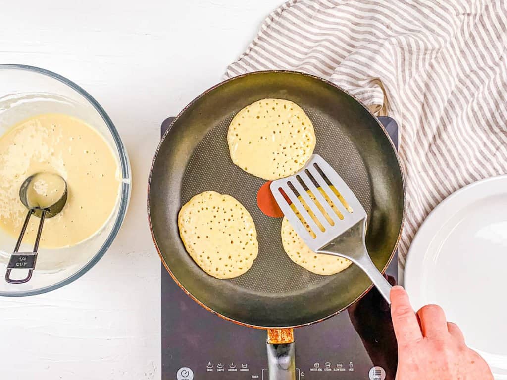 batter being flipped in a pan