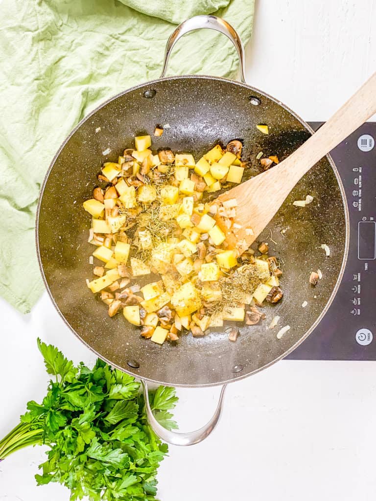 veggies sauteeing in a pan