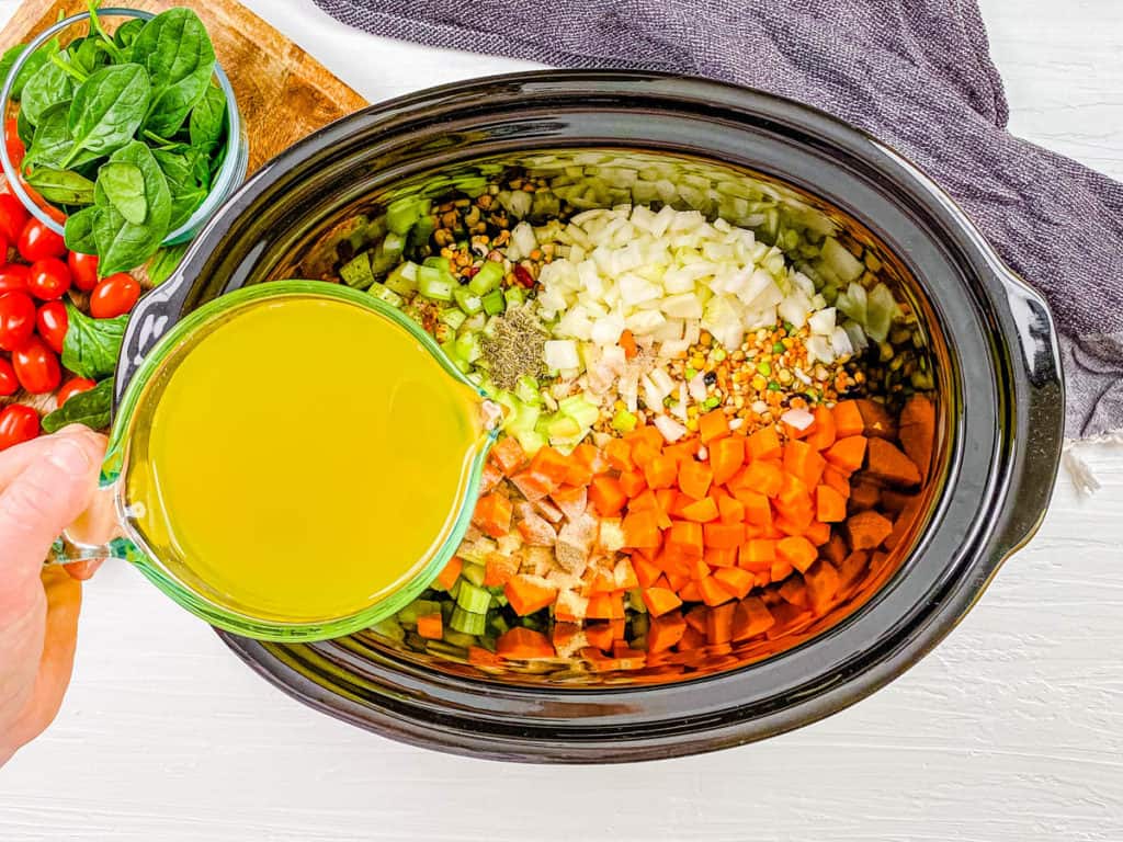 beans and veggies cooking in a slow cooker