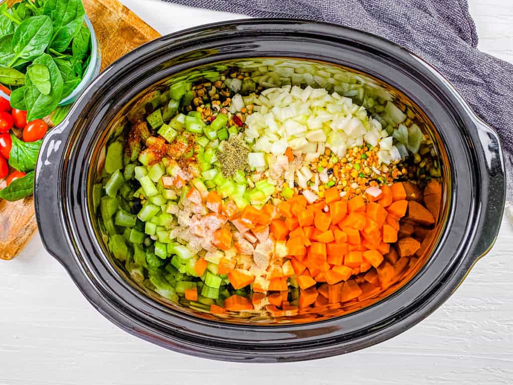 beans and veggies cooking in a slow cooker