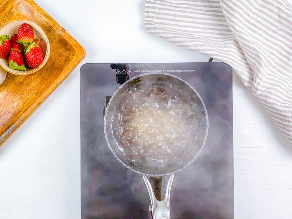 Boiling water tapioca pearls in a pot. 