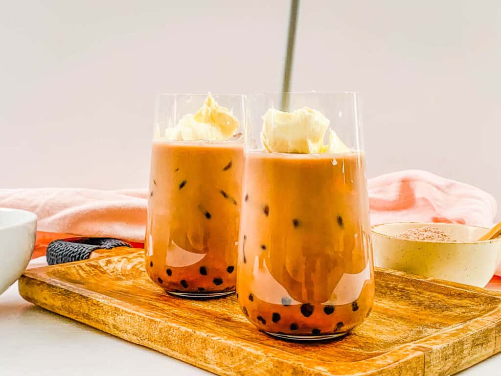 Easy chocolate milk tea with boba in a glass.