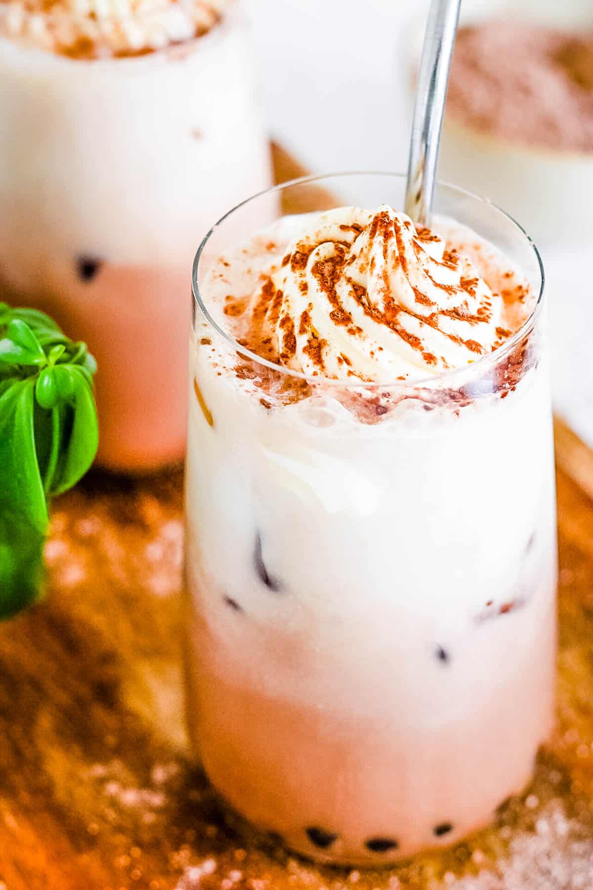 Dark chocolate milk tea with boba in a glass.