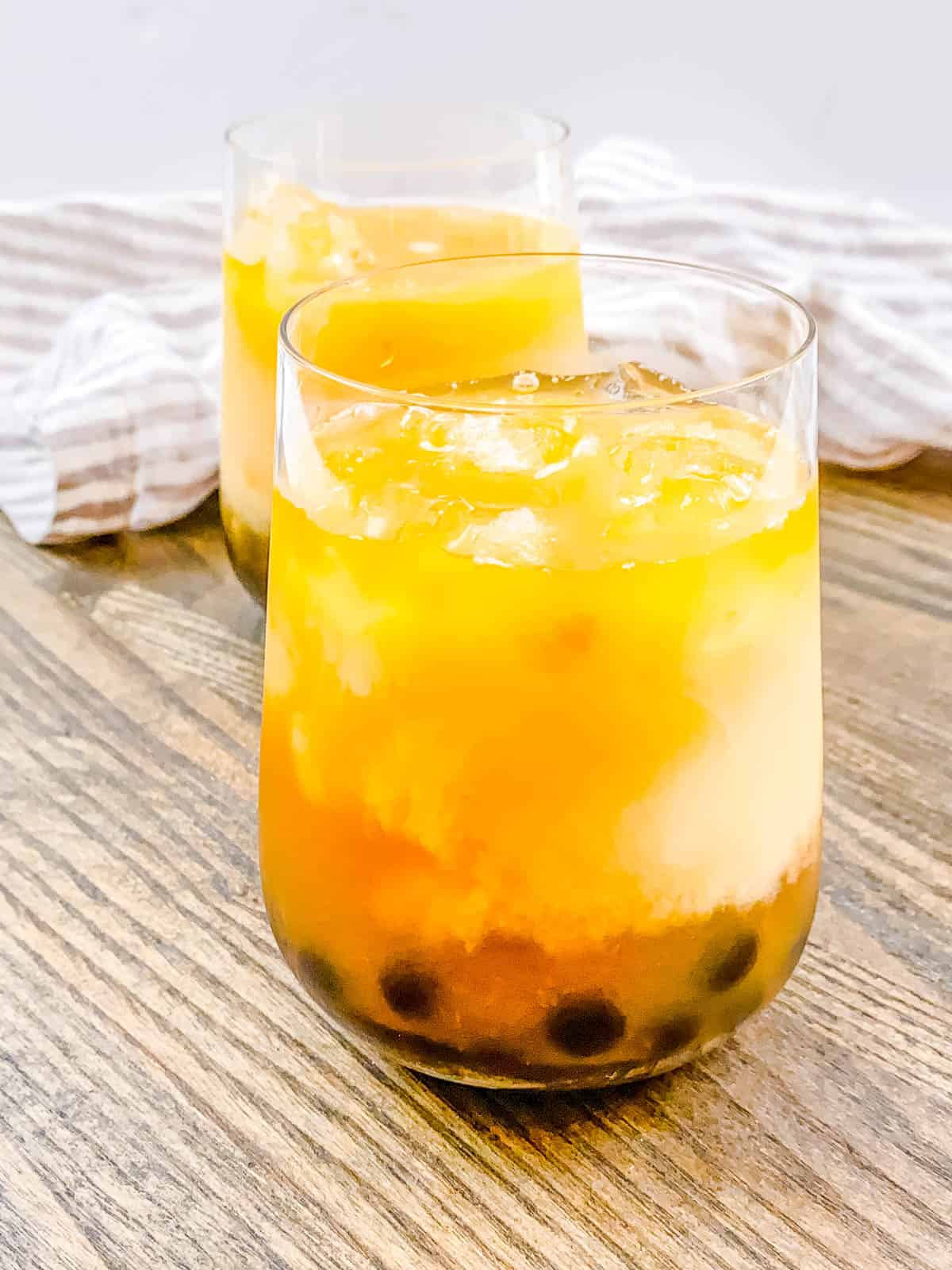 Wintermelon boba tea in a glass with ice.