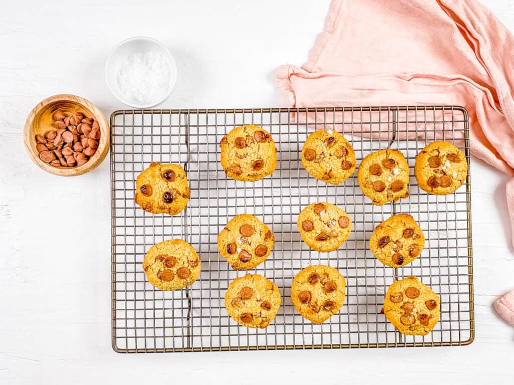 Baked oatmeal flour chocolate chip cookies on a wire rack.