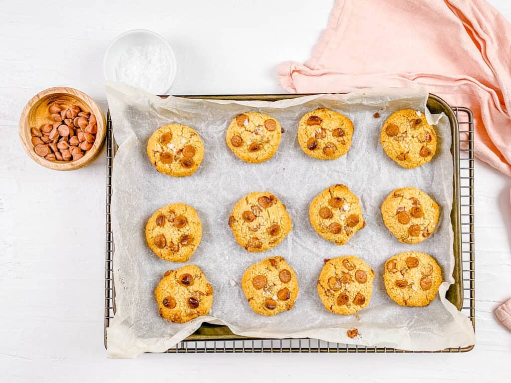 Unbaked oat flour cookies on a baking sheet lined with parchment paper.