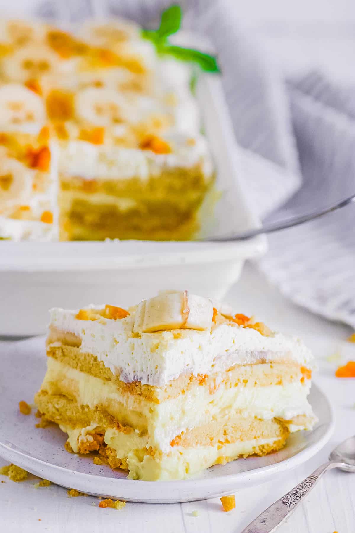 Slice of banana pudding lasagna on a white plate.