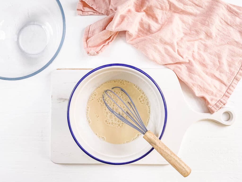 Batter for easy coconut flour pancakes in a mixing bowl.