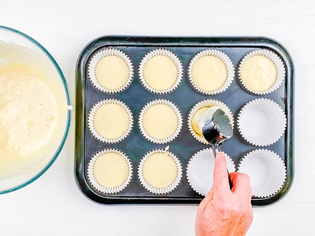 Batter for healthy cupcakes added to muffin tin.